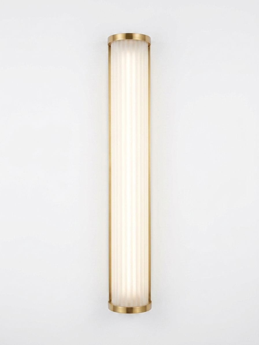 Fluted Column Wall Light, a brass and glass wall light, studio photograph on a white background