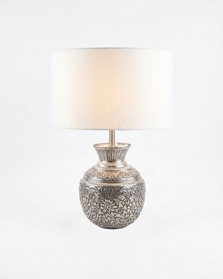 Repoussé Silver Surahi Table Lamp, a brass and fabric table lamp, studio photograph on a white background