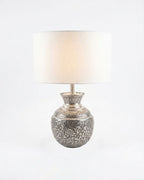 Repoussé Silver Surahi Table Lamp, a brass and fabric table lamp, studio photograph on a white background