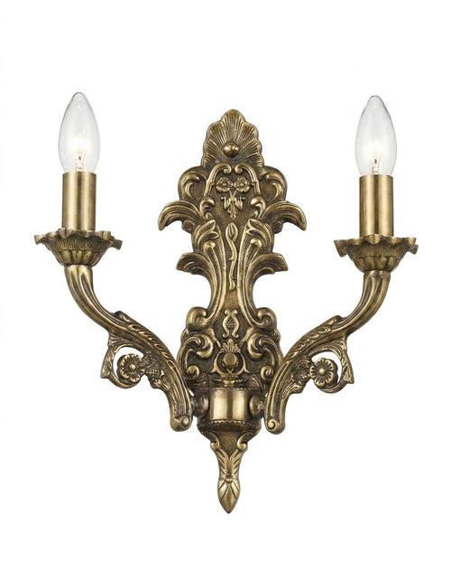 Baroque Candelabra Sconce, a brass wall light, studio photograph on a white background