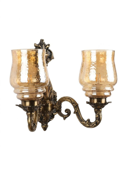 Baroque Amber Double Sconce, a brass and glass wall light, studio photograph on a white background