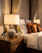 Repoussé Silver Surahi Table Lamp table lamp styled in bedroom, lights on