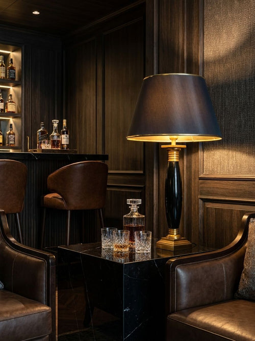 Black Ceramic Torpedo Table Lamp table lamp styled in an interior, lights on