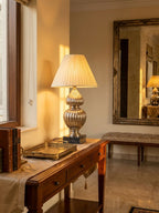 Silver Ribbed Gourd Table Lamp table lamp styled in an interior, lights on