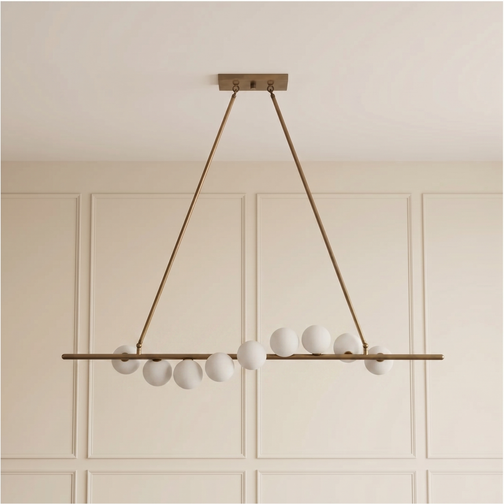 Vela Brass Globe Chandelier unlit