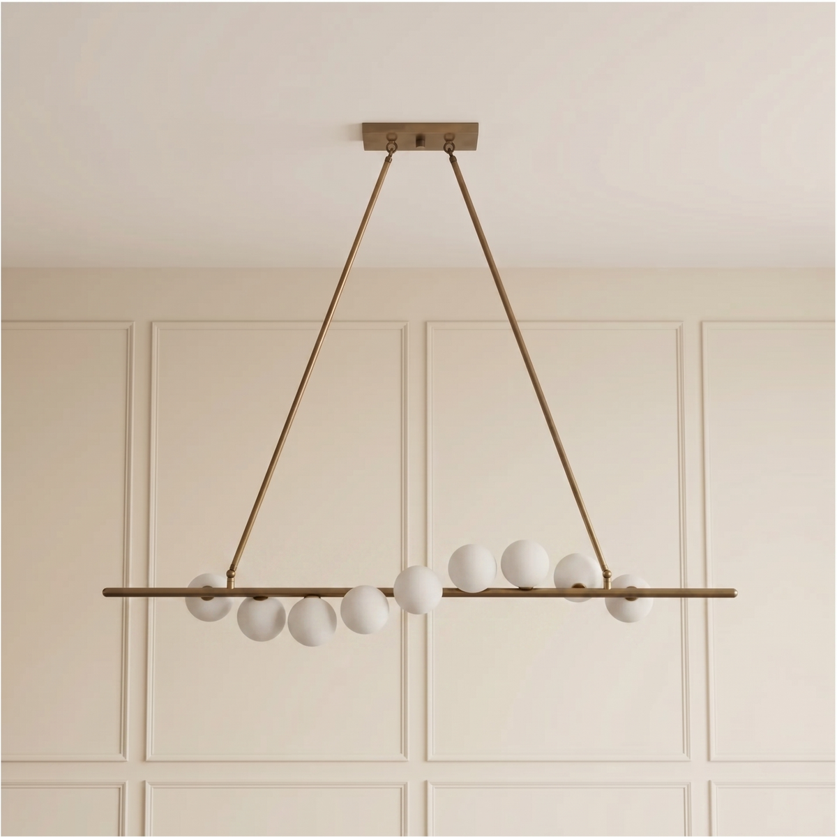 Vela Brass Globe Chandelier unlit