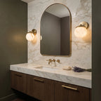 Luna Alabaster Globe Wall Light illuminated