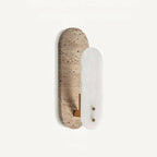 Ellisse stone wall light with alabaster and travertine