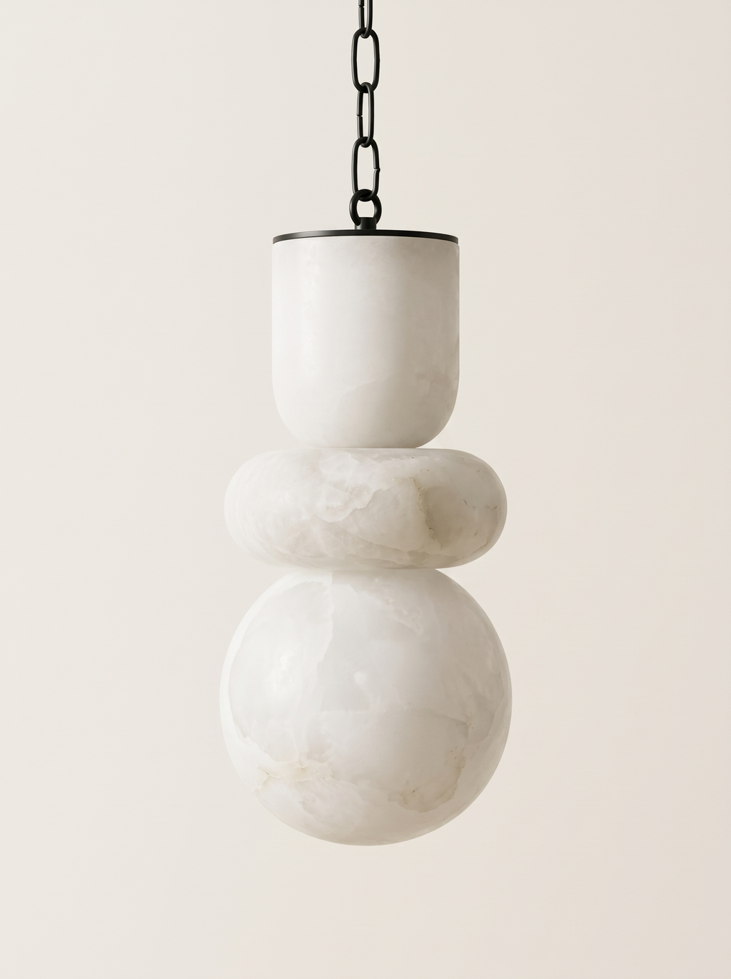 Alabaster Stack Pendant Light, three hand-turned natural alabaster forms on a black chain, front view