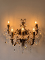 Bohemia Wall Light with all five candles lit, the cut glass and crystal sparkling