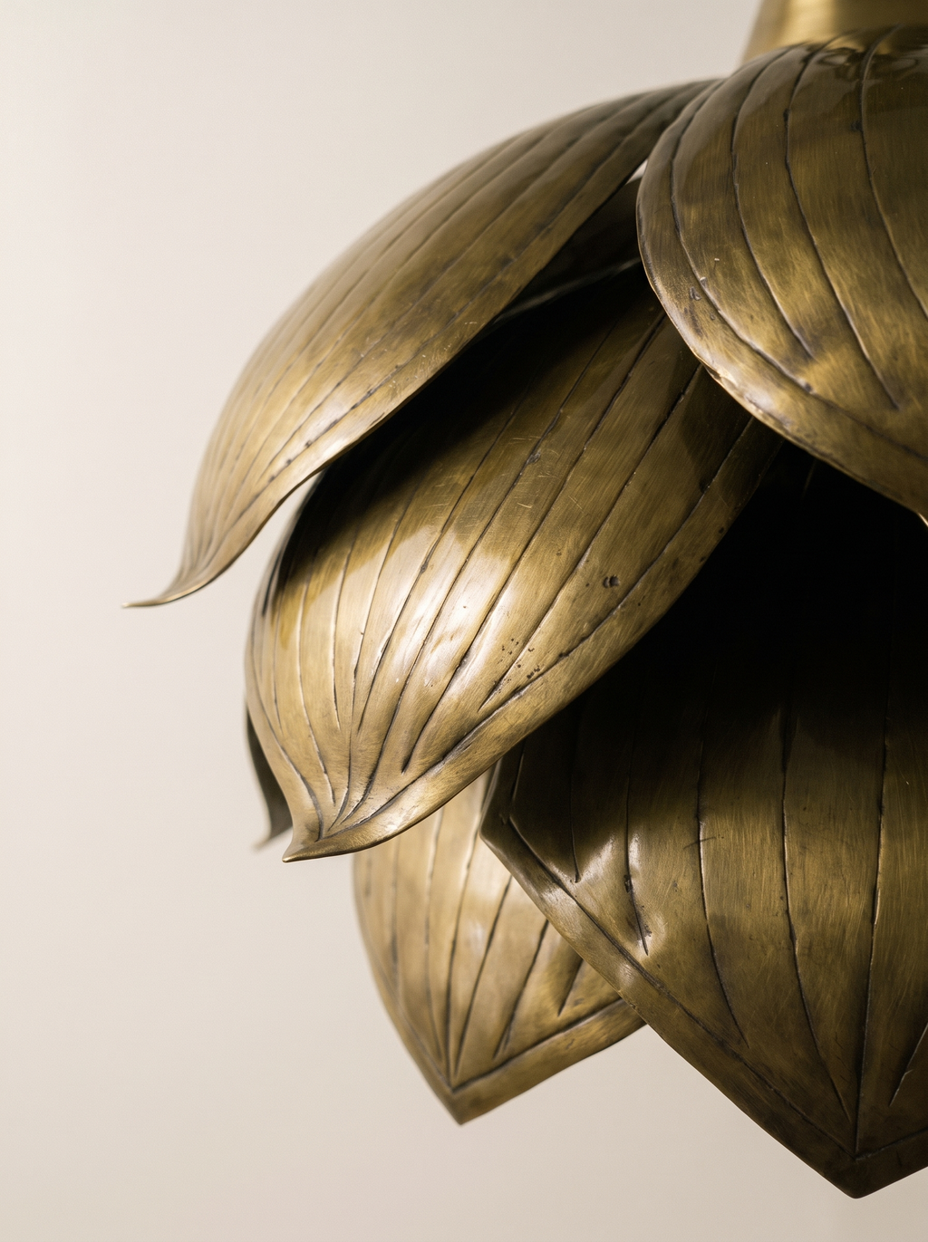 Close-up of the hand-etched vein lines on the brass petals