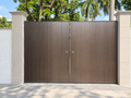Fluted aluminium main gate in a dark bronze finish