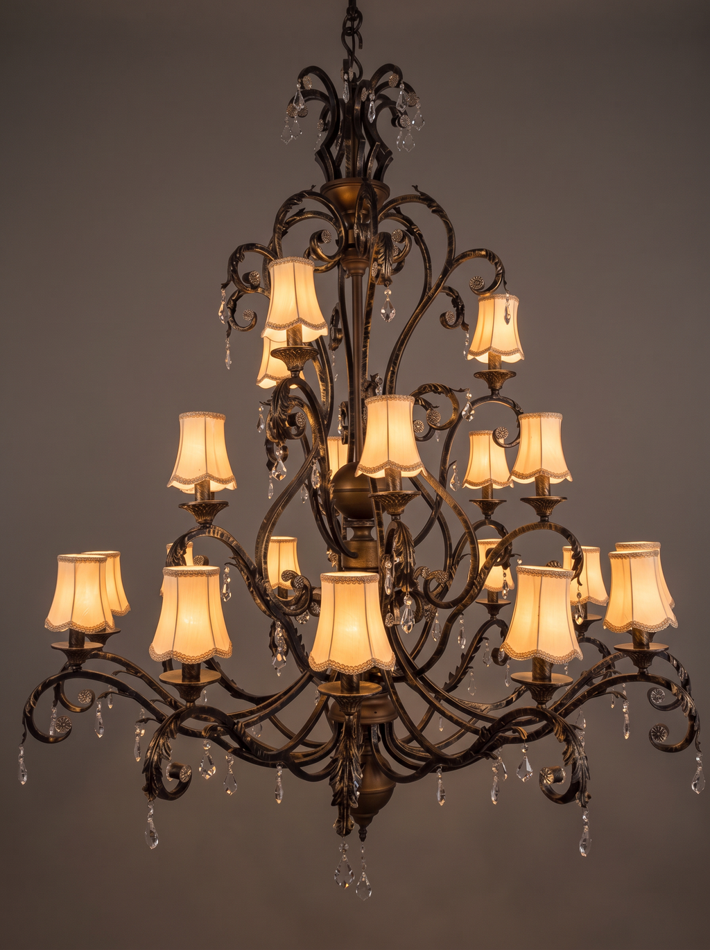 Toledo chandelier with all 21 shades lit warm amber