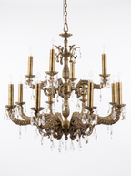 Granada 12-Light Cast Brass and Crystal Chandelier, heavy cast brass arms in pierced Moorish openwork with tall candle sleeves and crystal drops, front view