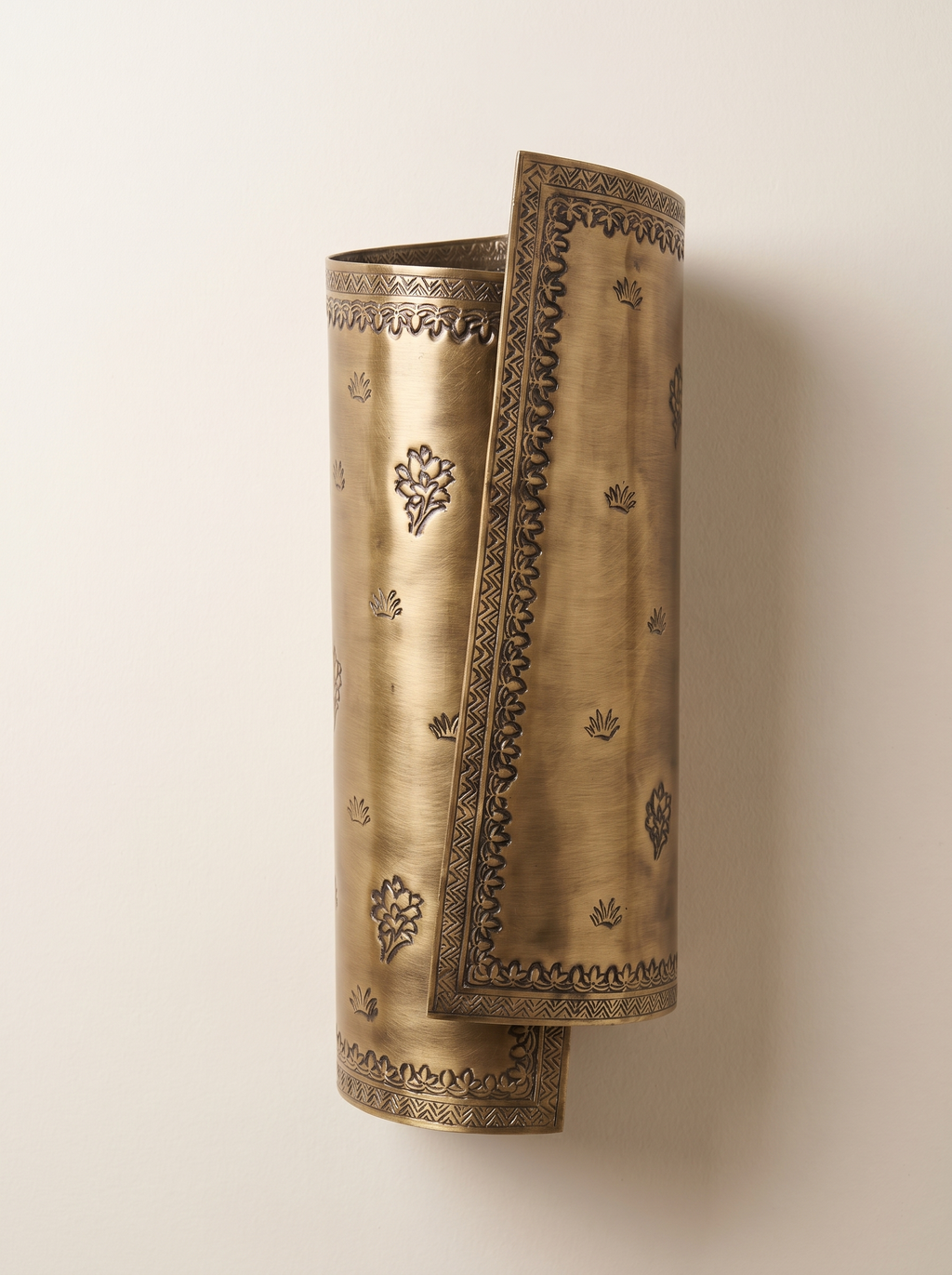 Patra Scroll Sconce right-wrap version, front view: the mirror-image half of the pair