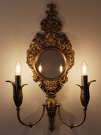 Rococo Mirror Double Wall Light switched on, two candle bulbs glowing and reflected in the round mirror