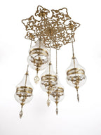 Brass Blossom Cluster, a brass and fabric chandelier, studio photograph on a white background