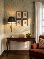Brass Parrot Table Lamp on a rosewood console against botanical bird wallpaper in a sunlit Delhi drawing room